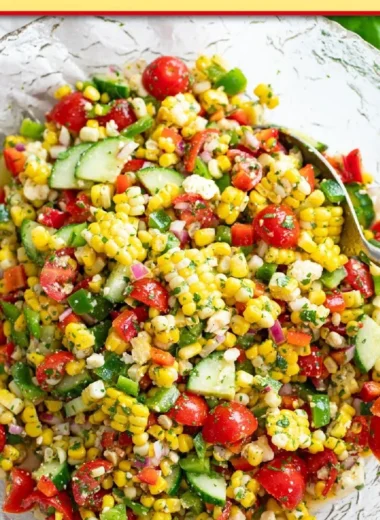 Fresh corn salad with colorful vegetables and dressing on a plate