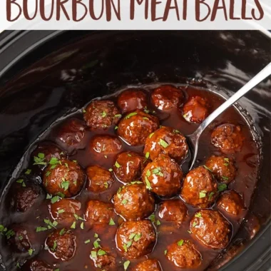 Slow Cooker Bourbon Meatballs simmering in a bourbon glaze sauce.