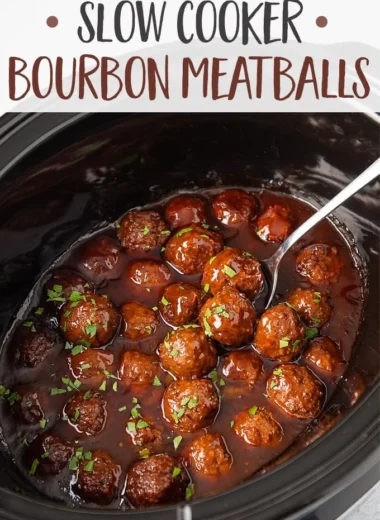 Slow Cooker Bourbon Meatballs simmering in a bourbon glaze sauce.