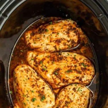 Juicy slow cooker chicken breasts served with vegetables