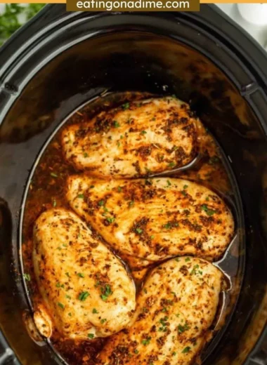 Juicy slow cooker chicken breasts served with vegetables