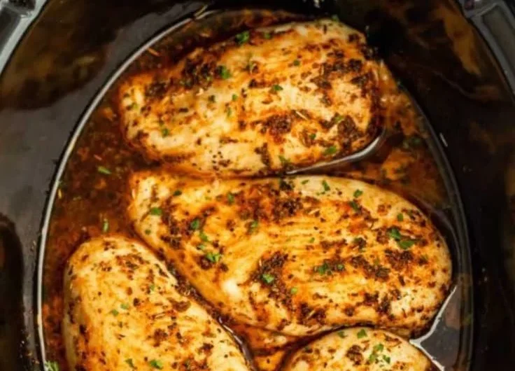 Juicy slow cooker chicken breasts served with vegetables