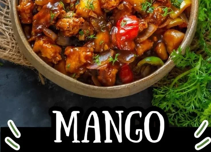 Delicious Asian Mango Chicken dish garnished with fresh herbs