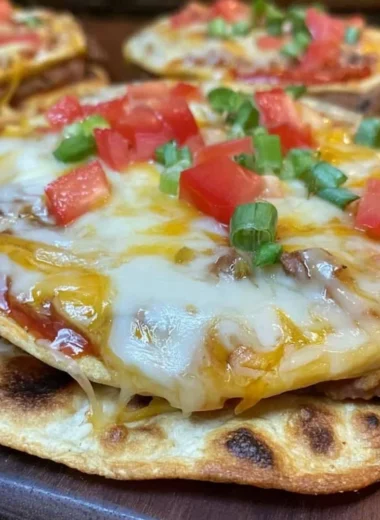 Delicious homemade Copy Cat Taco Bell Mexican Pizza topped with fresh ingredients