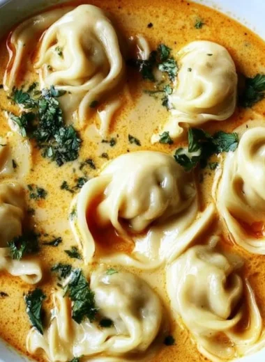 Creamy Thai Dumpling Soup with vibrant herbs and spices