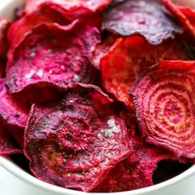 Healthy baked beet chips served in a bowl