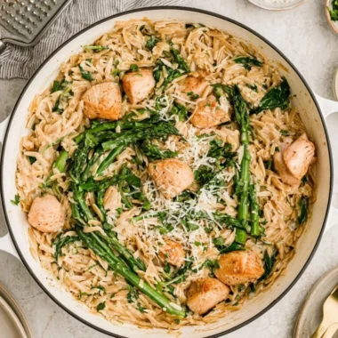 High protein chicken orzo dish with fresh ingredients and herbs