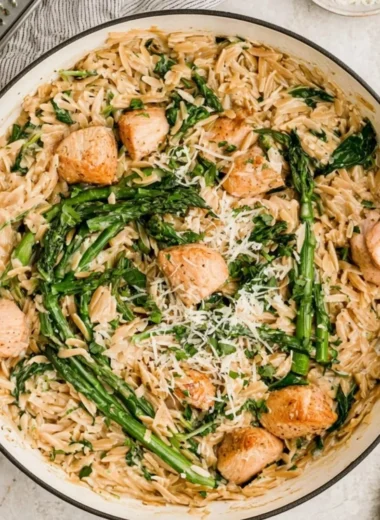 High protein chicken orzo dish with fresh ingredients and herbs