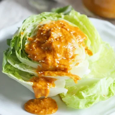Bowl of Japanese carrot ginger dressing served with fresh greens