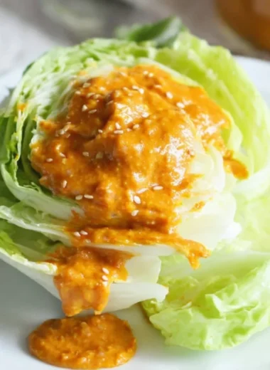 Bowl of Japanese carrot ginger dressing served with fresh greens
