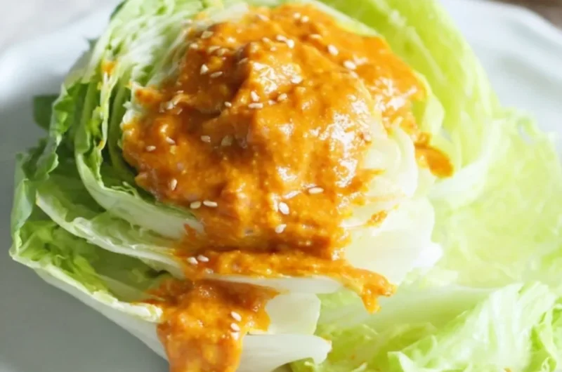 Bowl of Japanese carrot ginger dressing served with fresh greens