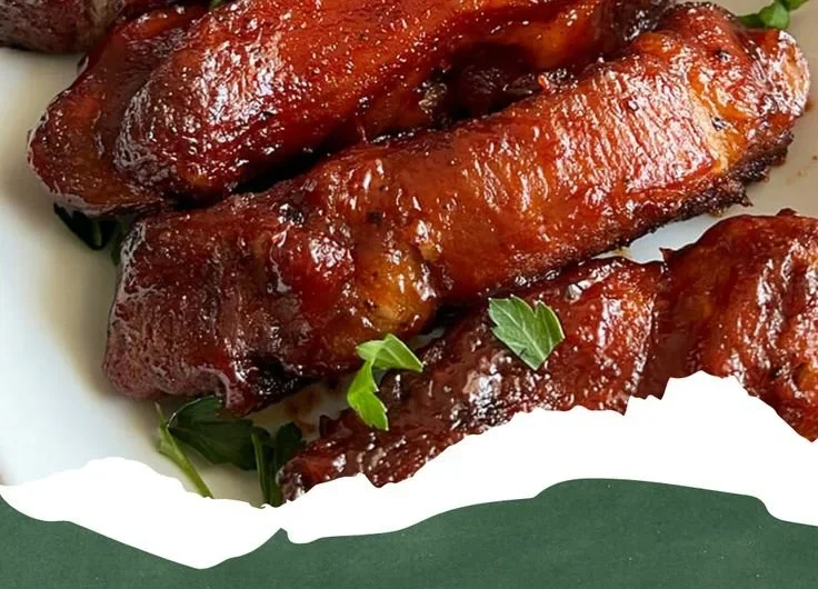 Oven-roasted country-style pork ribs on a serving platter