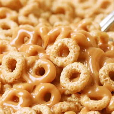 A bowl of peanut butter cereal bites with a playful design, perfect for snacking.