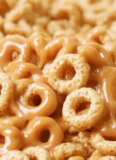 A bowl of peanut butter cereal bites with a playful design, perfect for snacking.