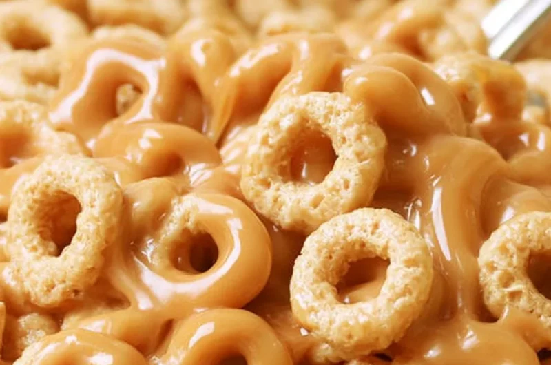 A bowl of peanut butter cereal bites with a playful design, perfect for snacking.