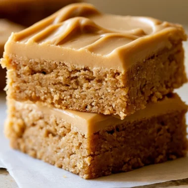 Peanut Butter Lunch Lady Bars topped with chocolate and peanut butter drizzle