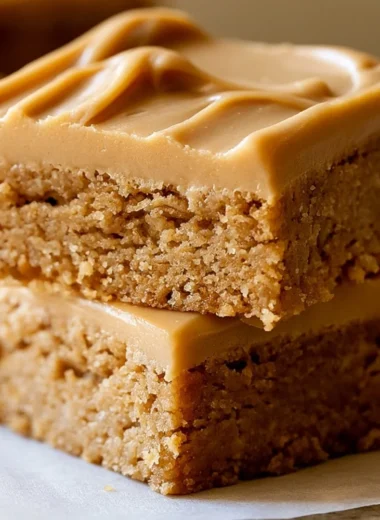Peanut Butter Lunch Lady Bars topped with chocolate and peanut butter drizzle