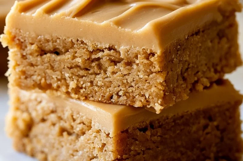 Peanut Butter Lunch Lady Bars topped with chocolate and peanut butter drizzle