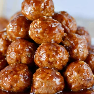 Savory slow cooker Hawaiian teriyaki meatballs garnished with green onions.