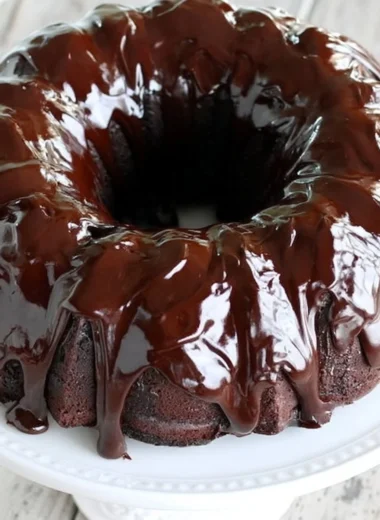 Cozy chocolate sour cream pound cake garnished with chocolate shavings