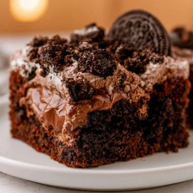 Delicious dirt cake served in a charming setting with chocolate and gummy worms.