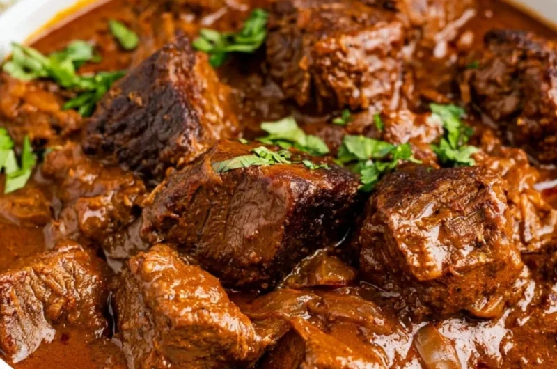 Cozy beef vindaloo dish served in a bowl with spices and herbs