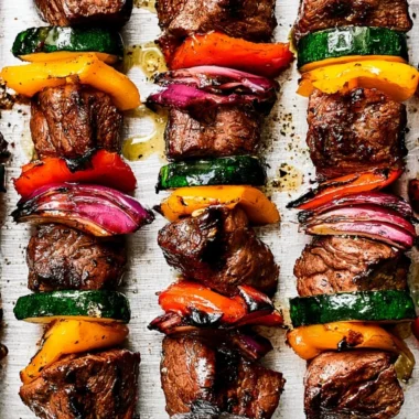 Delicious cozy steak kabobs on skewers ready for grilling.