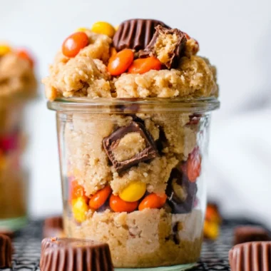 Delicious edible peanut butter cookie dough in a bowl with a spoon