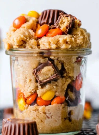 Delicious edible peanut butter cookie dough in a bowl with a spoon