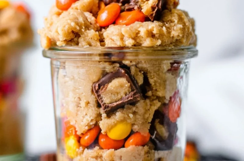 Delicious edible peanut butter cookie dough in a bowl with a spoon