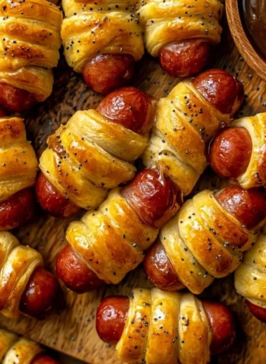 Delicious glazed pigs in a blanket served on a platter