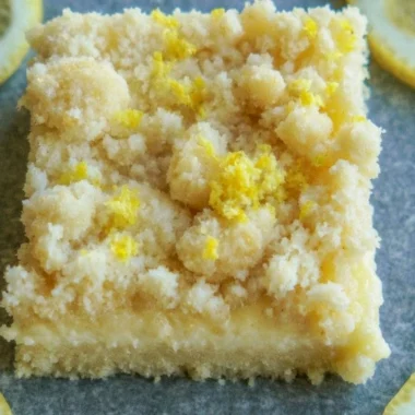 Delicious lemon sugar cookie bars topped with lemon zest and sugar.