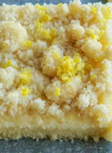 Delicious lemon sugar cookie bars topped with lemon zest and sugar.