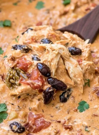 Creamy Slow Cooker Crack Chicken Chili with cream cheese and spices