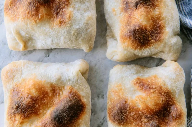 Freshly baked sourdough ciabatta bread with a golden crust and airy texture