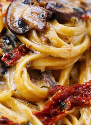 Delicious sun-dried tomato mushroom pasta served in a cozy bowl