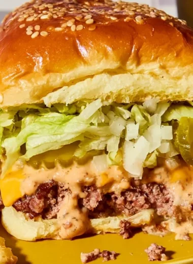 Delicious Big Mac Sliders served on a wooden board, perfect for a cozy gathering.