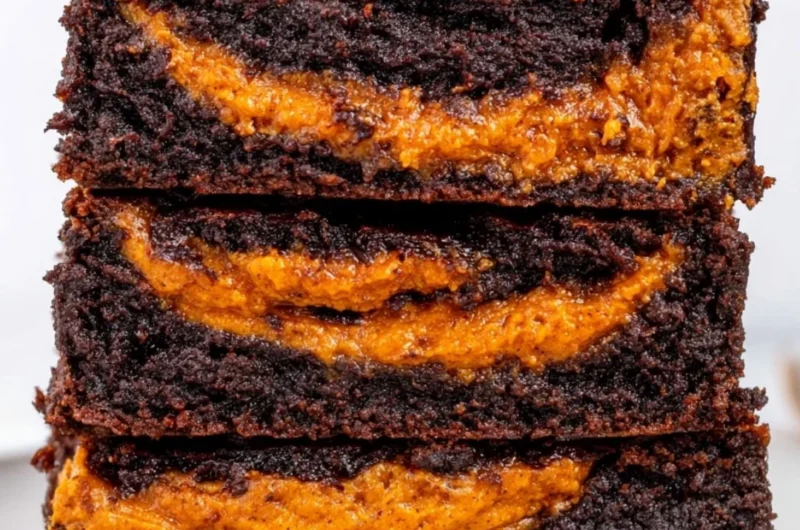Delicious homemade pumpkin brownies topped with chocolate drizzle