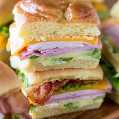 Platter of ultimate club sandwiches for a crowd.