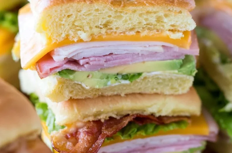 Platter of ultimate club sandwiches for a crowd.